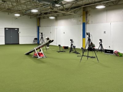 The research team sets up video equipment near the teeter.