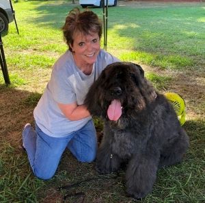 Photo of Heritage Society member June Guido and her Bourvier des Flandres, Hugo