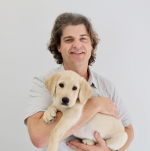 photo of Dr. Brian Hare holding a puppy