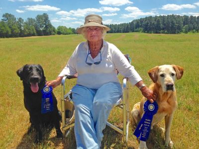 photo of Katharine Simonds with two Labrador Retrievers