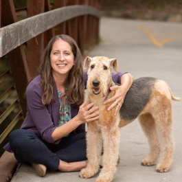 photo of Dr. Montgomery with her Airedale Terrier